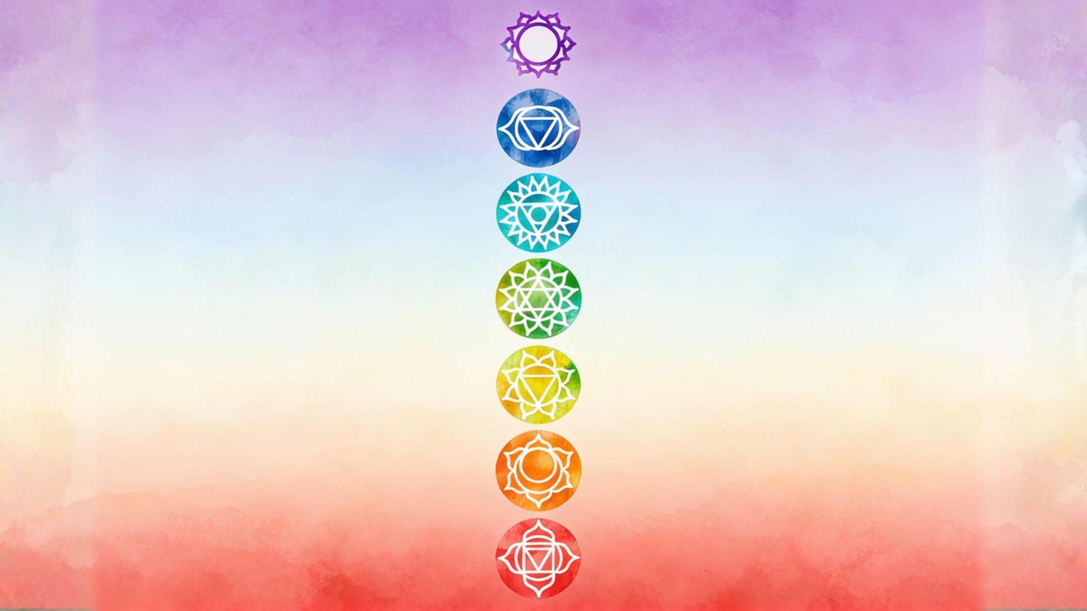 Sieben Chakra-Symbole in Regenbogenfarben von Rot bis Violett, künstlerisch, harmonisch
